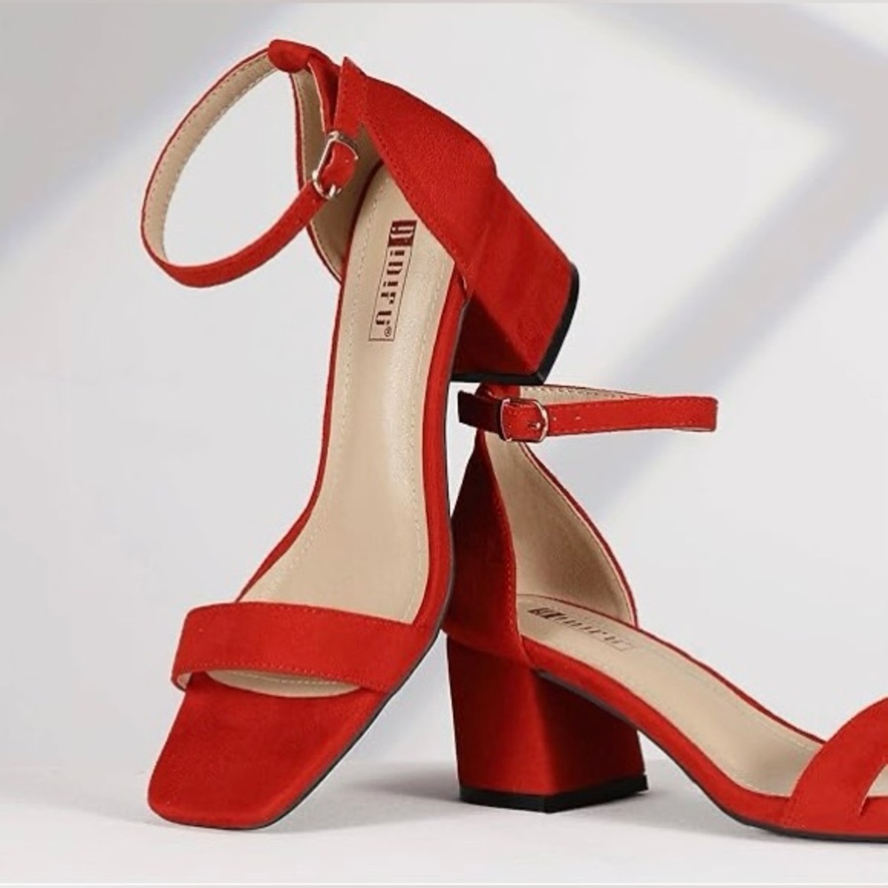 Red chunky heel shoes with ankle strap.